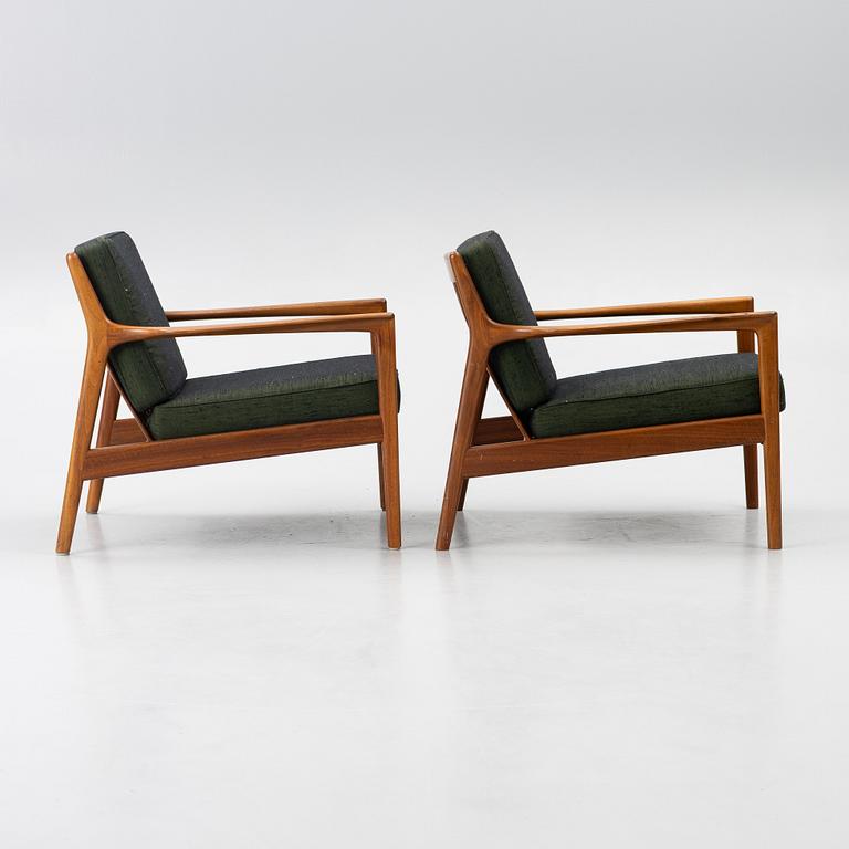Folke Ohlsson, a pair of 'USA 75' armchairs, Dux, Sweden, 1960's.