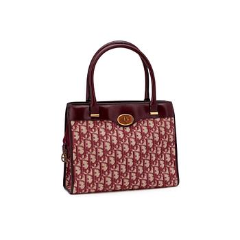 593. CHRISTIAN DIOR, a red monogram canvas handbag.