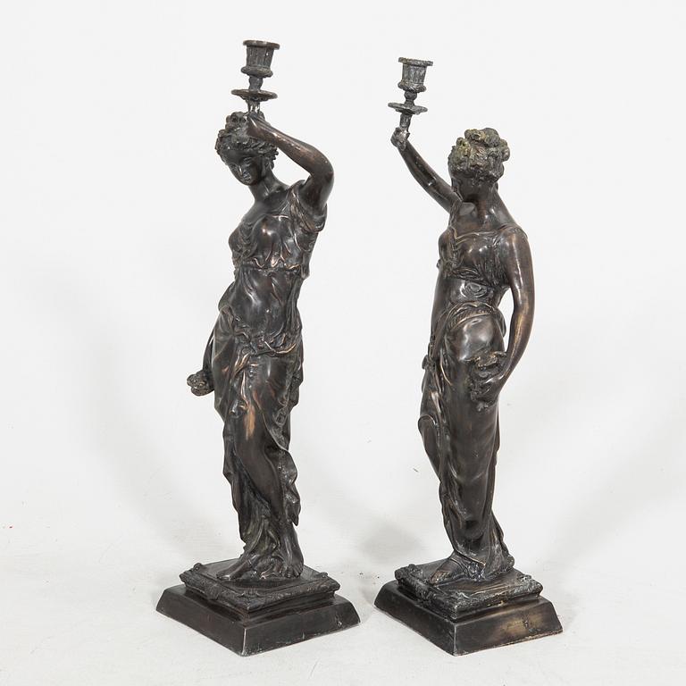 Auguste Moreau after a pair of sculptures/candle sticks patinated bronze.