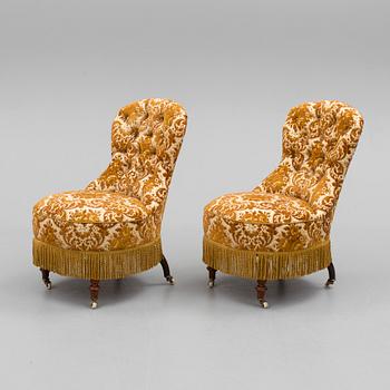 A pair of easy chairs, circa 1900.