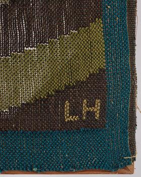 Lillian Holm, a tapestry, flat weave, ca 180,5 x 82 cm, signed LH. With the frame ca 182x79 cm.