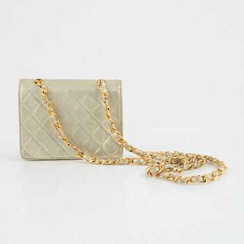 Chanel, micro flap bag, 1989-1991.
