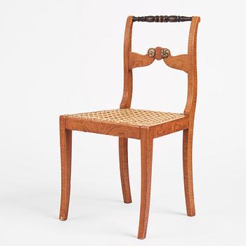 An Empire chair, first half of the 19th century.