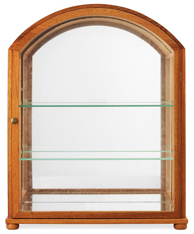 A Josef Frank mahogany showcase cabinet by Svenskt Tenn, model 2030.