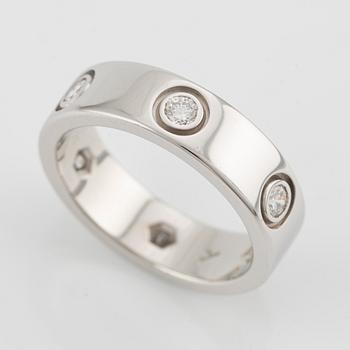 Cartier "Love" ring in 18K white gold with round brilliant-cut diamonds.