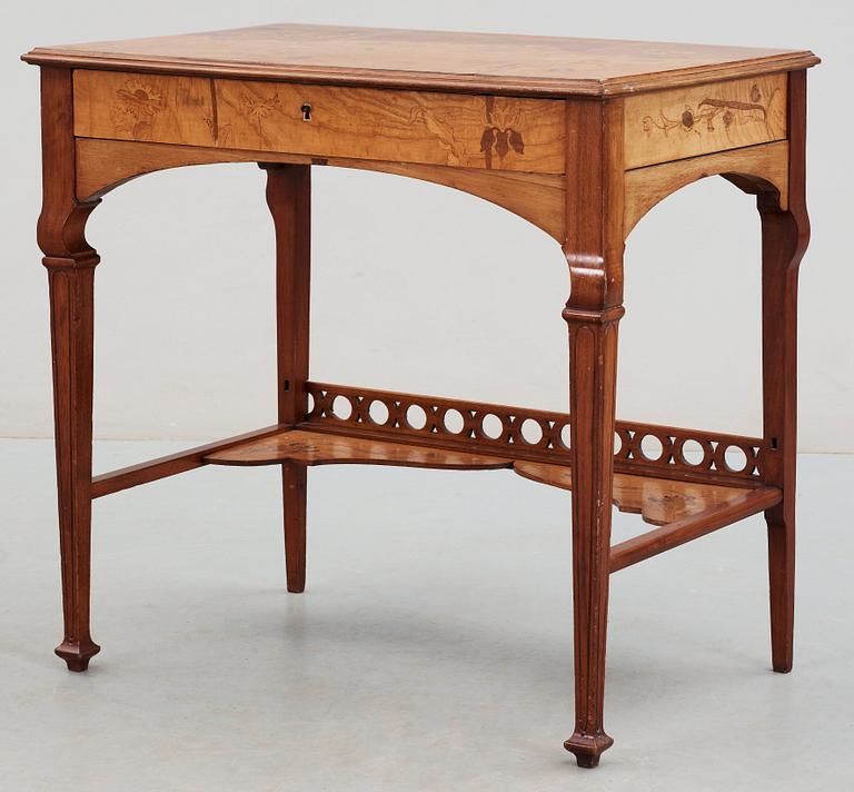 An Art Nouveau mahogany lady's desk with inlays of flowers in different kind of woods,