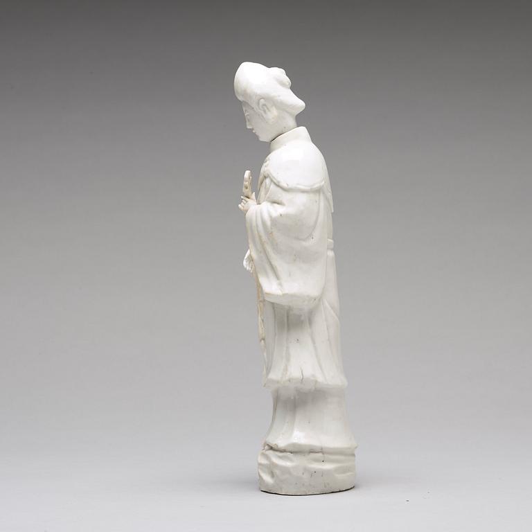 A blanc de chine figure of a lady-in-waiting, Qing dynasty, Kangxi (1662-1722).