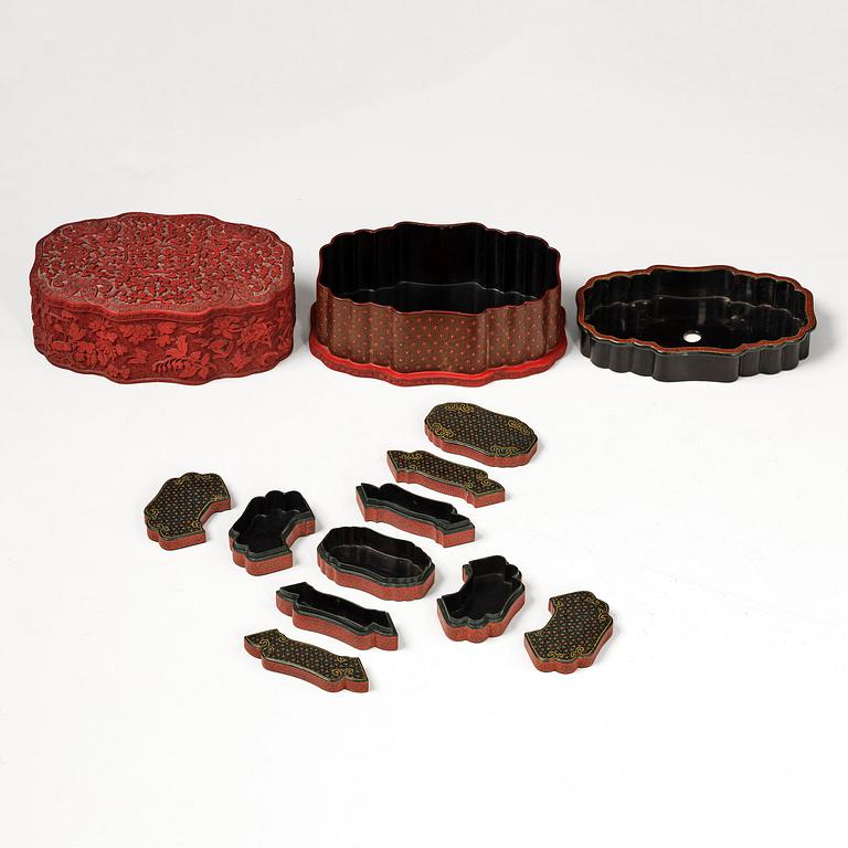 A fine carved lacquer box and cover with tianqi lacquer inset boxes and covers, Qing dynasty, Qianlong (1736-95).