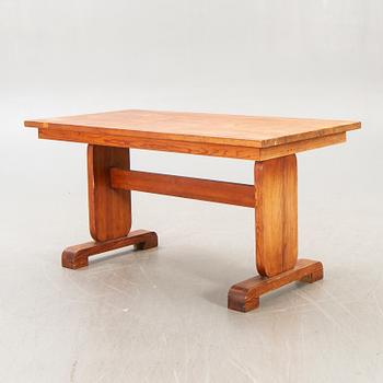 A 1940s pine dining table.