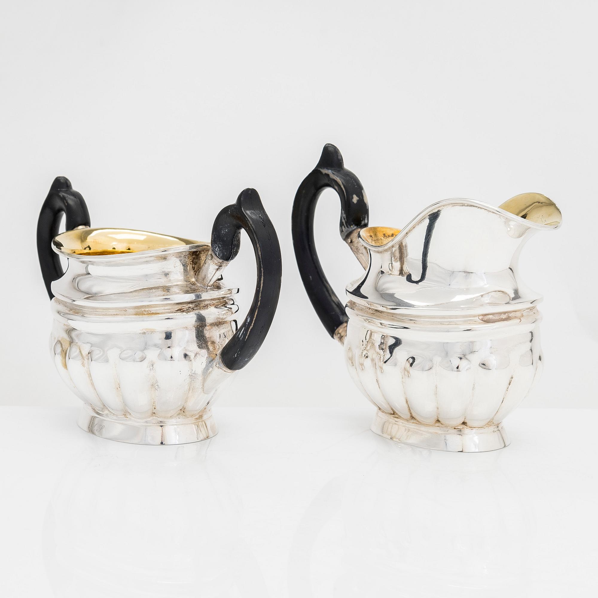 Sugar bowl and cream jug, and four pieces of silver cutlery, Vyborg, Turku, Hämeenlinna and Helsinki 1926-60.