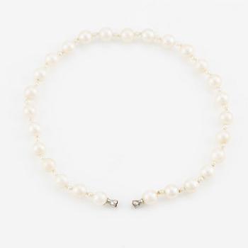 Ole Lynggard lås i form av snäcka 18K vitguld med en rund briljantslipad diamant.