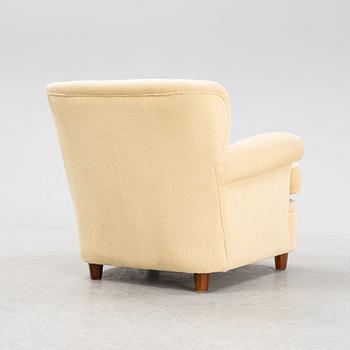 Josef Frank, a model 568 armchair by  Firma Svenskt Tenn.