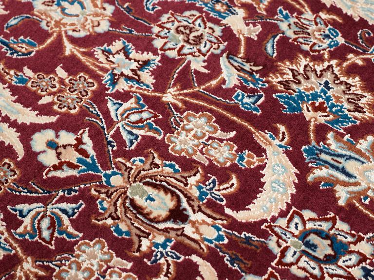 A CARPET, a semi-antique/old Esfahan/Nain part silk, ca 232,5 x 137,5 cm (as well as one end with ca 1 cm flat weave).