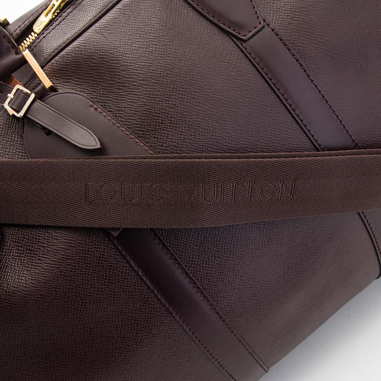 Louis Vuitton, a 'Taiga Kendall PM' weekend bag.