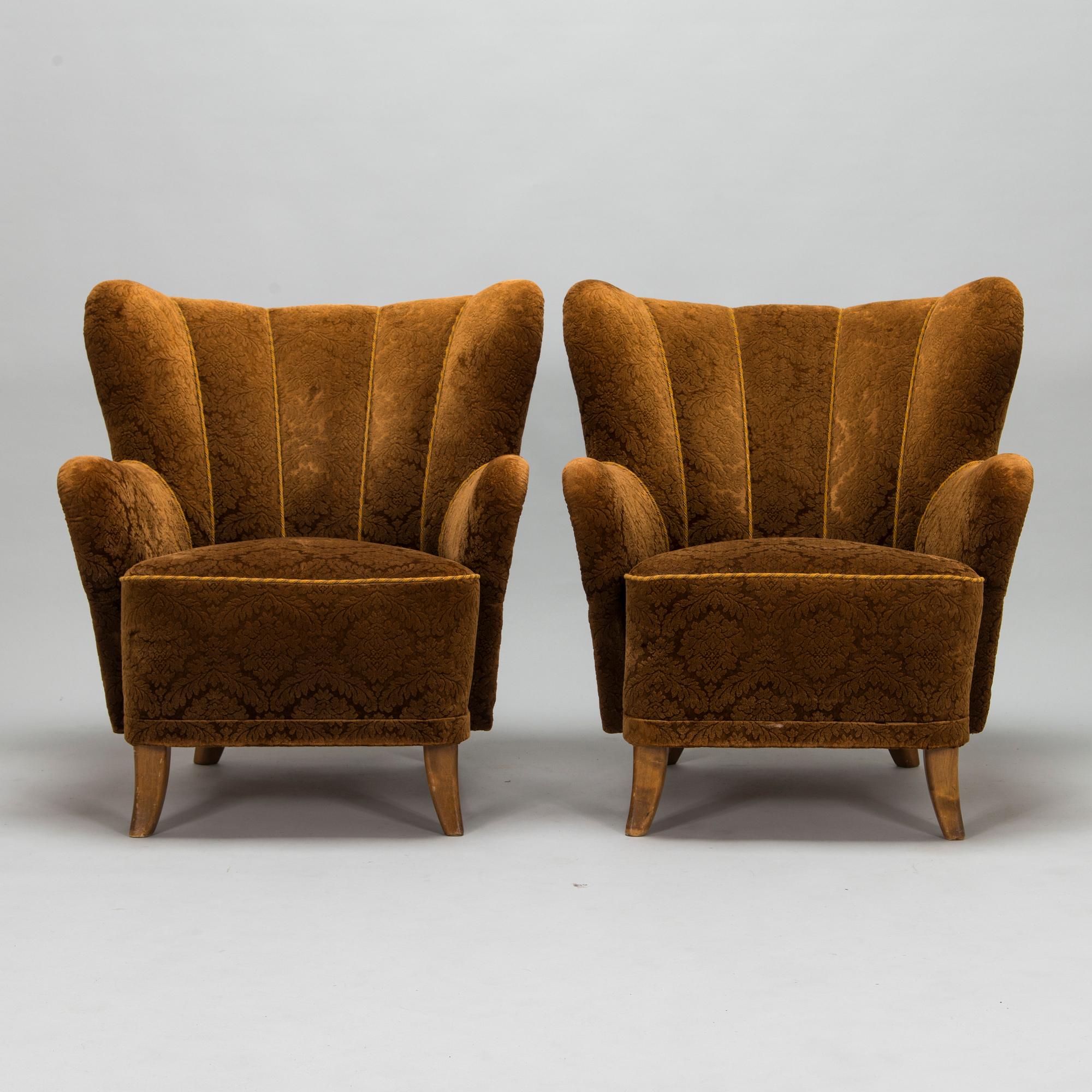 A pair of mid-20th-century armchairs.