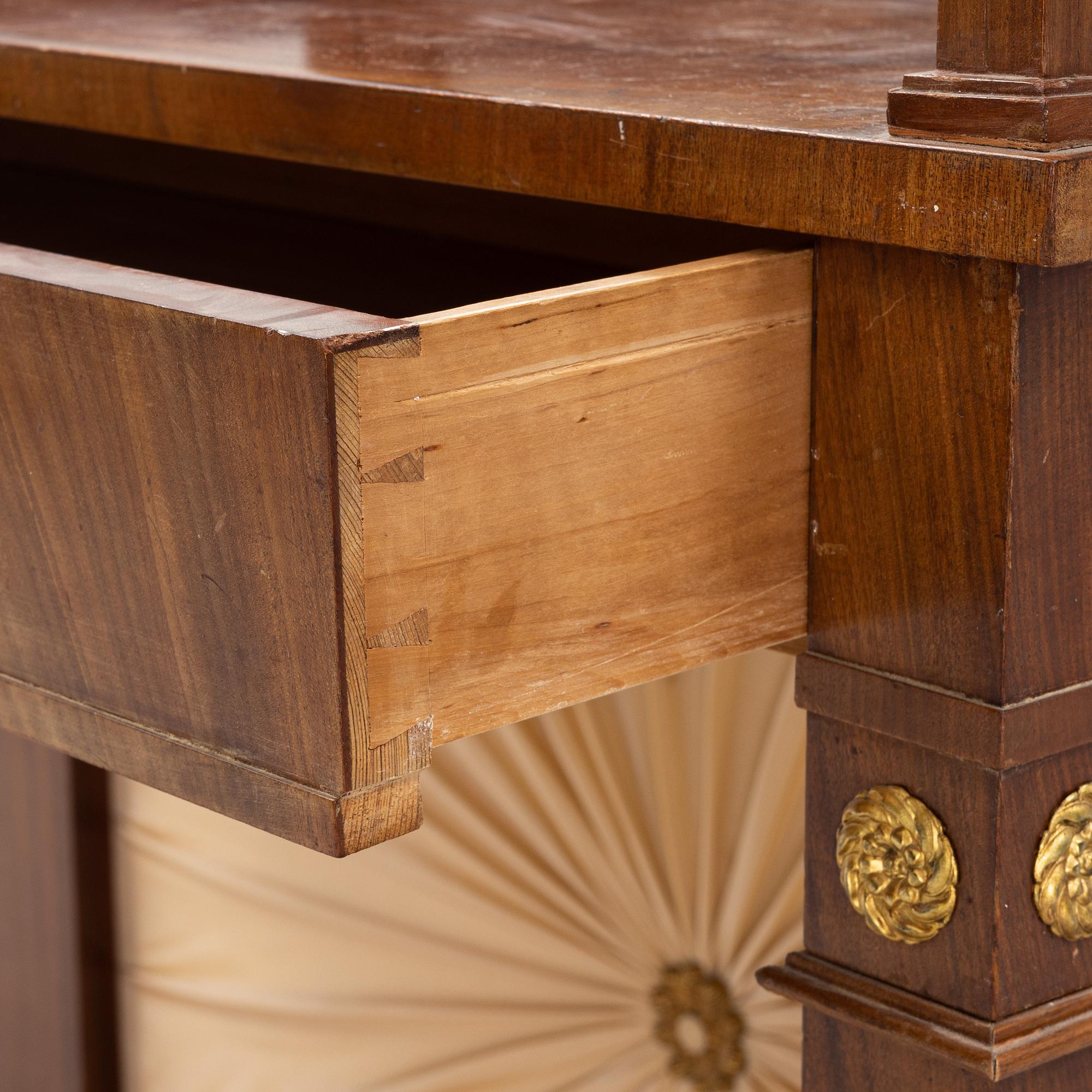 An Empire style dressing table by Johan Öman, Stockholm (1815-33), dated 1827.