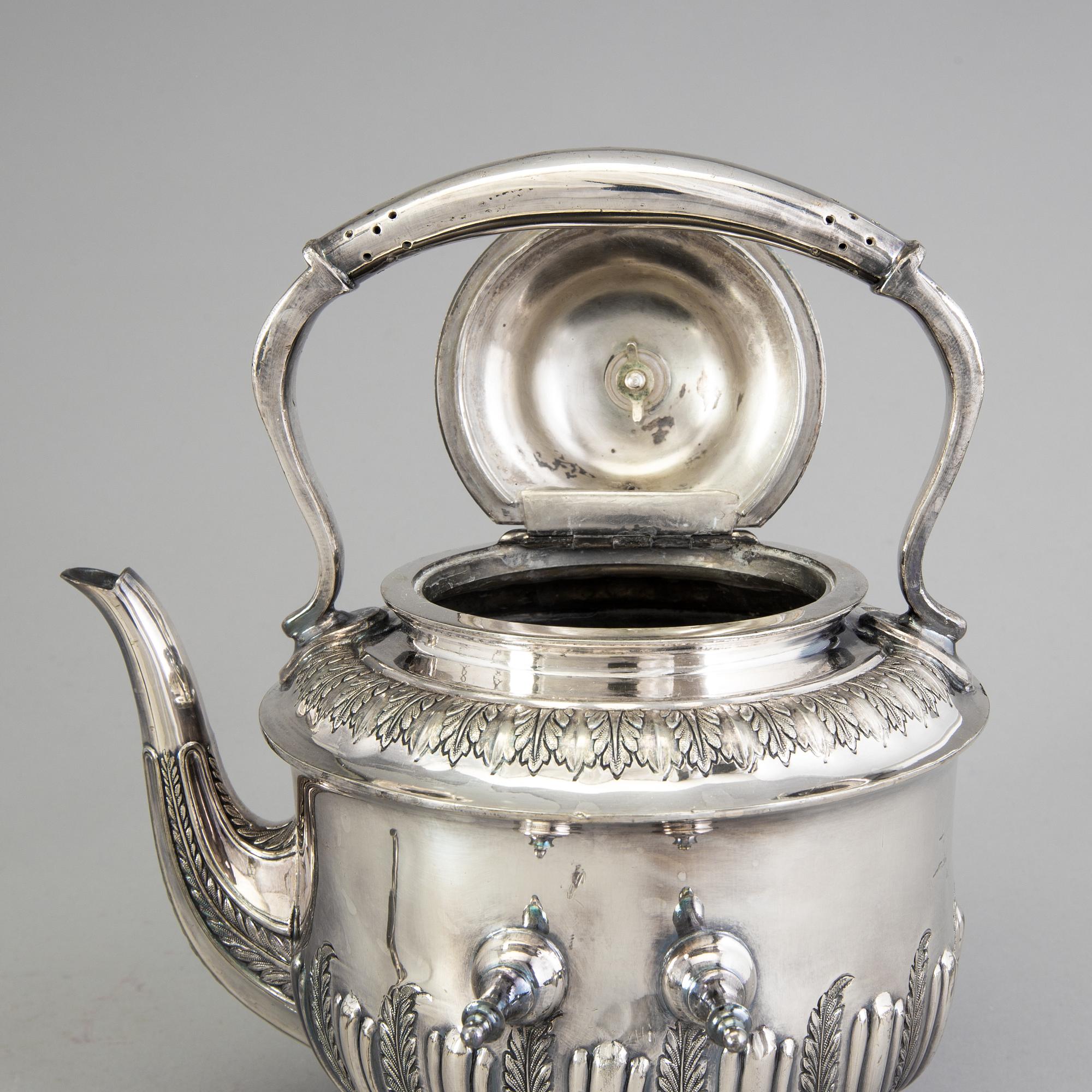 A 20th century tea pot on stand by Walker & Hall, Sheffield, England.