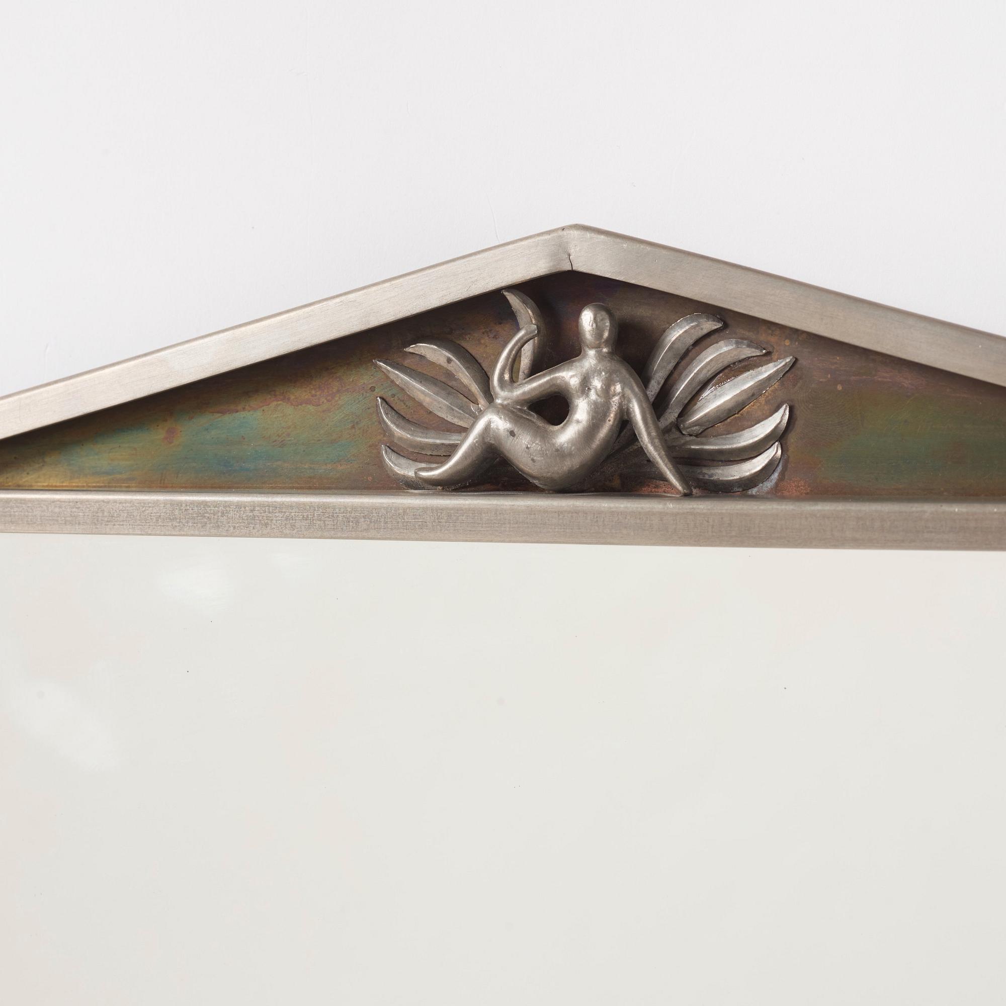 Nils Fougstedt, a Swedish Grace pewter and brass mirror model "137 a", Firma Svenskt Tenn, Stockholm 1927.