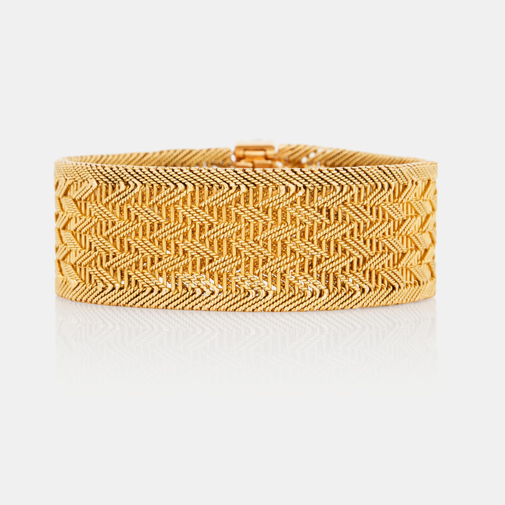 A diamond and gold bracelet. Total carat weight of diamonds circa 0.50ct.