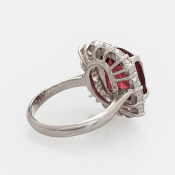 A platinum ring with spinel and brilliant cut diamonds.