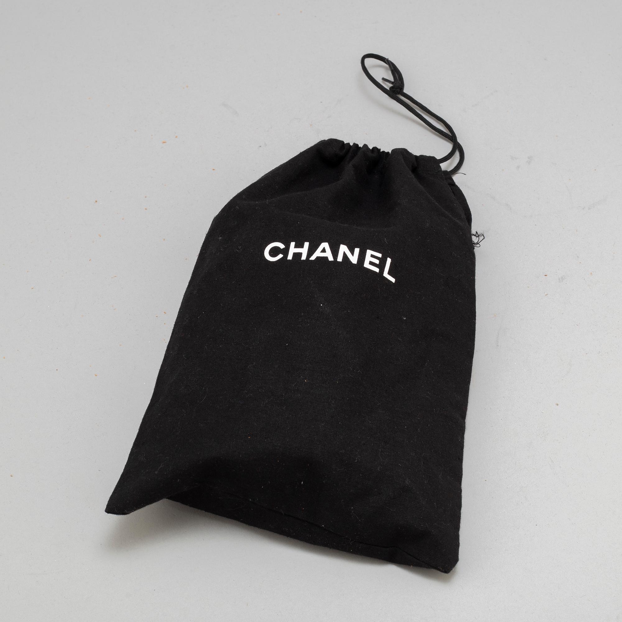 CHANEL, a black leather 'Extra mini flap bag' 2012-13.