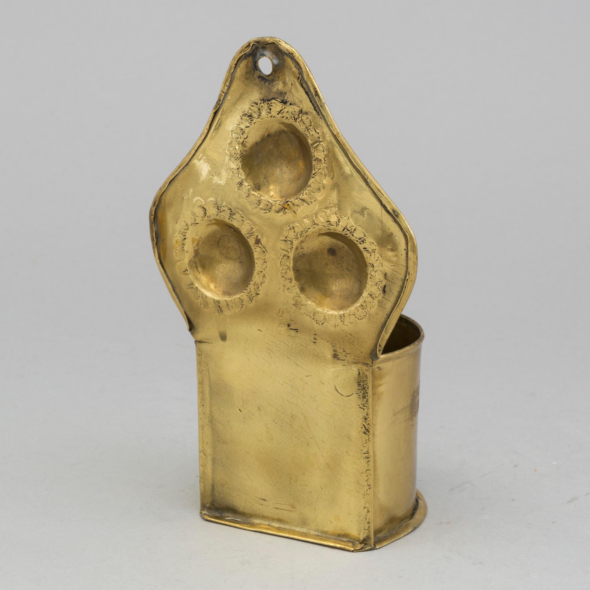 A 19th century brass spoon holder.