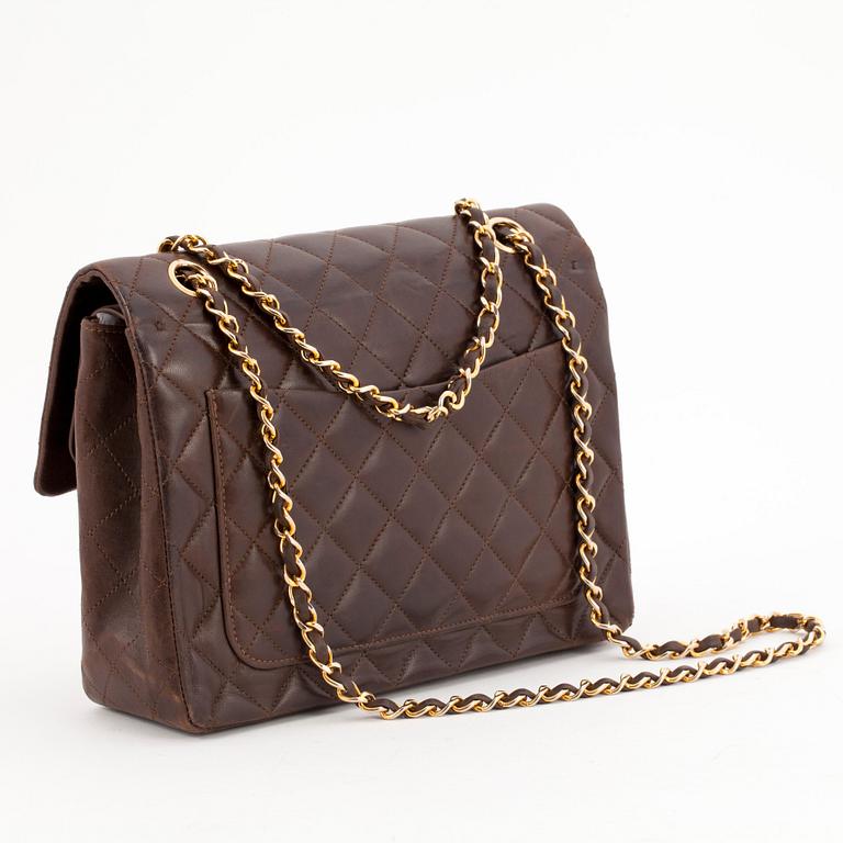 CHANEL, a quilted brown leather purse, "Flap Bag".