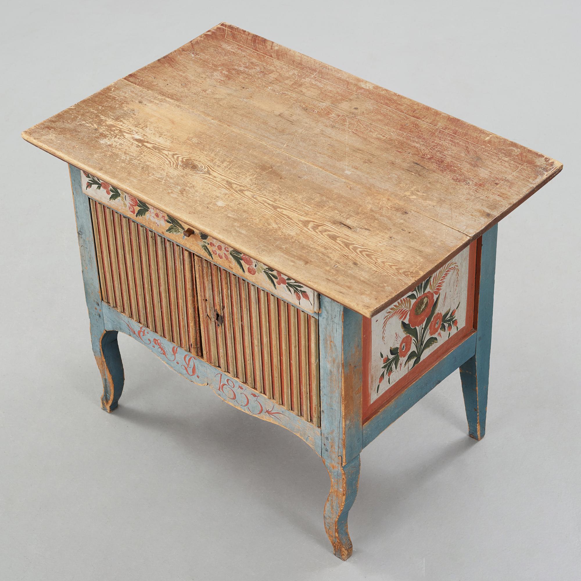 A painted pine table marked E.S.D 1833.