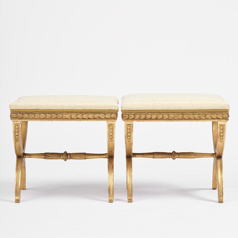 A pair of late Gustavian giltwood stools, Stockholm, late 18th century.