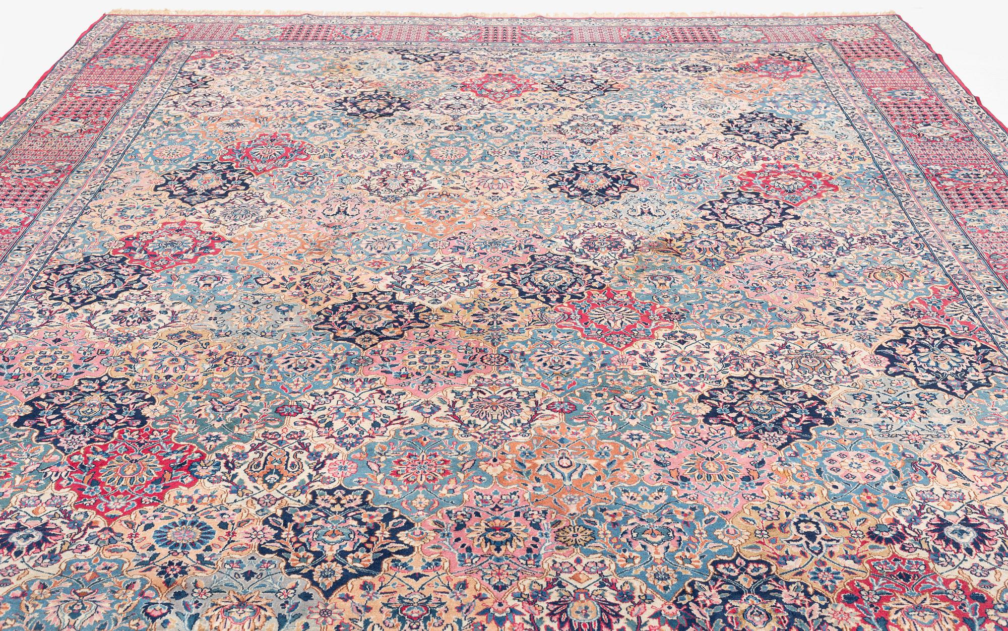 A semi-antique Kerman carpet, of Safavid 'vase' design, ca 484 x 291 cm.