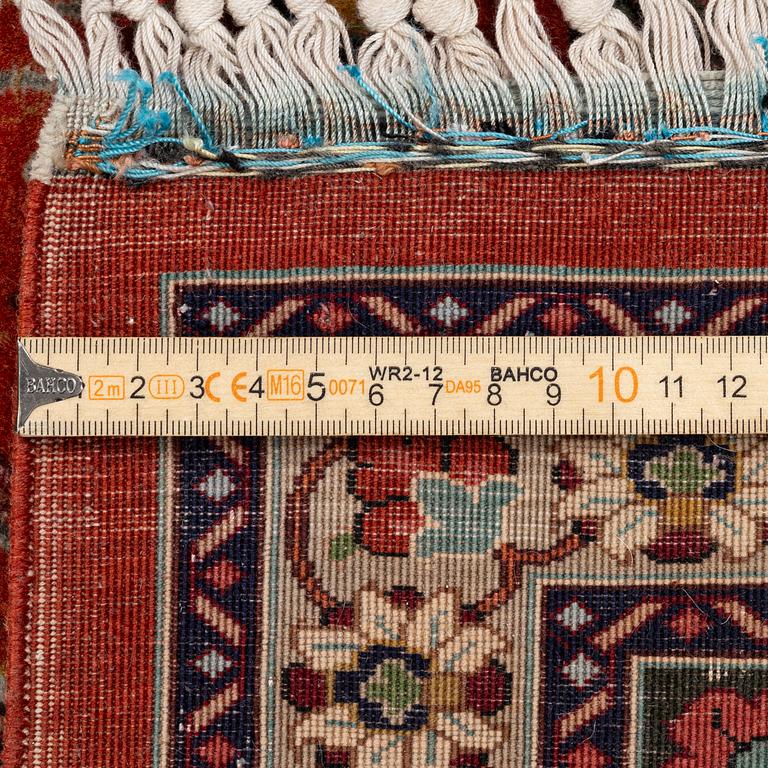 A part silk Tabriz carpet, c. 268 x 179 cm.