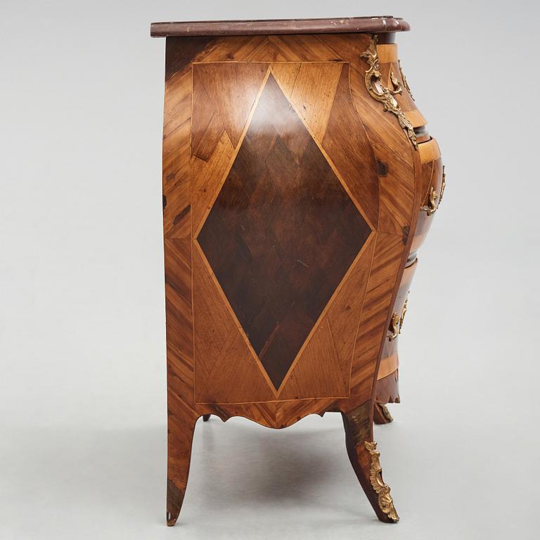 A Swedish rosewood-veneered Rococo chest of drawers, later part of the 18th century.