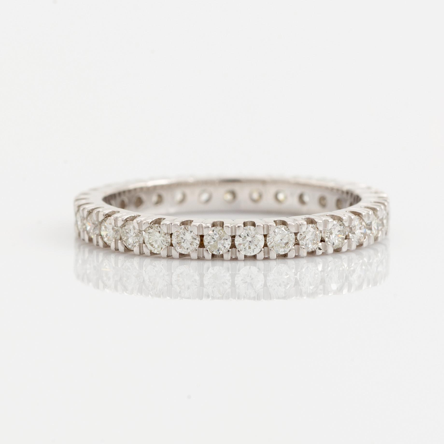 Brilliant cut diamond eternity ring.