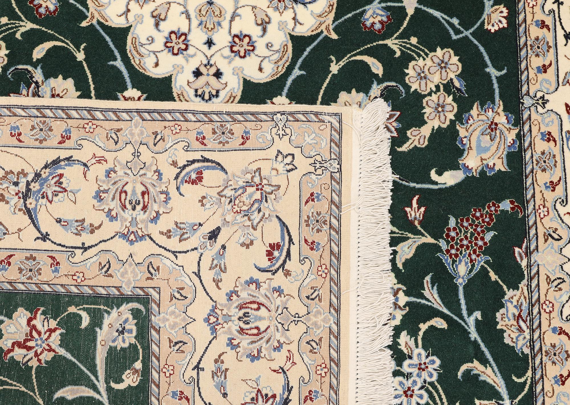 A part silk Nain rug, so-called 9LAA, approx. 257 x 161 cm.