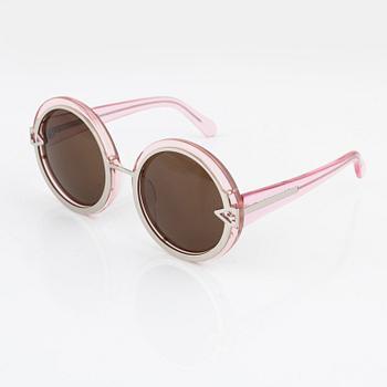 Karen Walker, a pair of pink "Orbit" sunglasses.