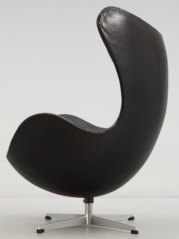 An Arne Jacobsen black leather 'Egg' chair, Fritz Hansen, Denmark, circa 1960.