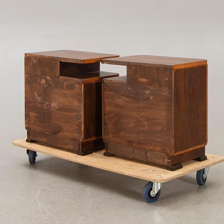 A pair of walnut/mahogany bedside tables first half of the 20th century.