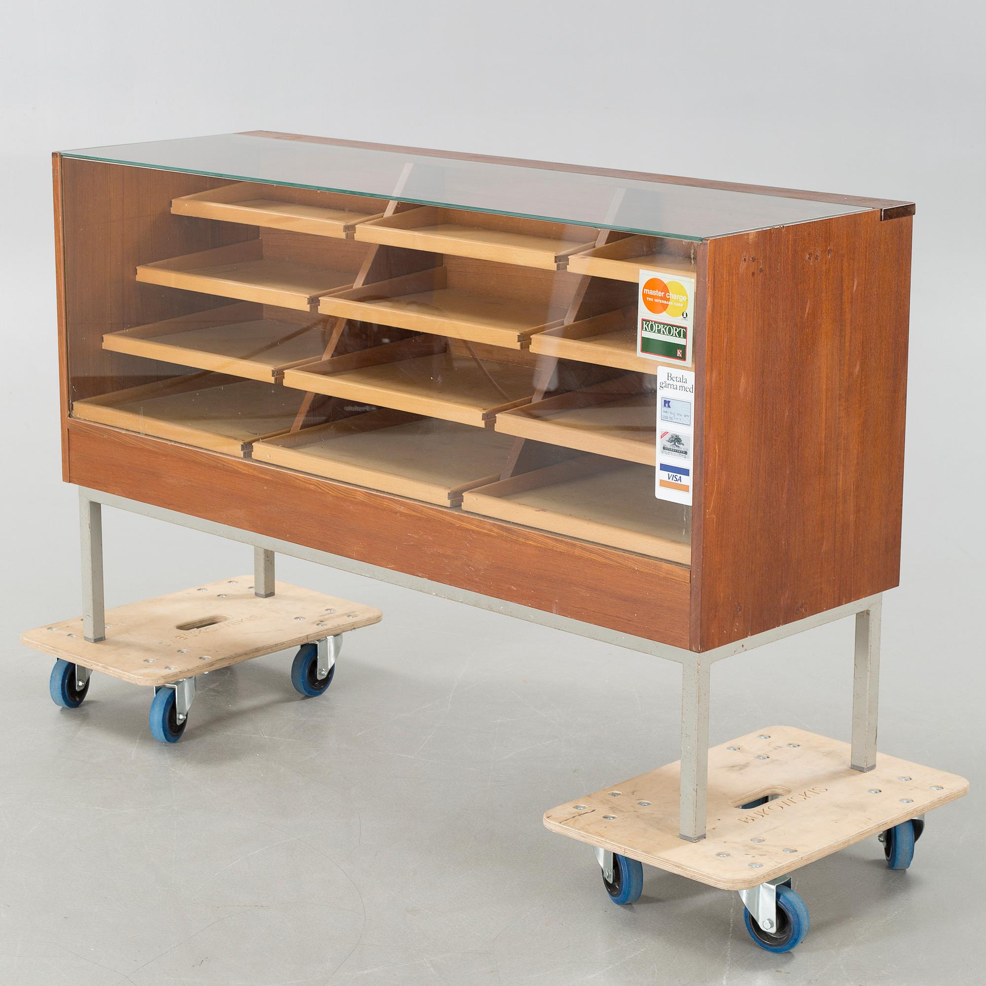 A circa mid 20th century store counter.