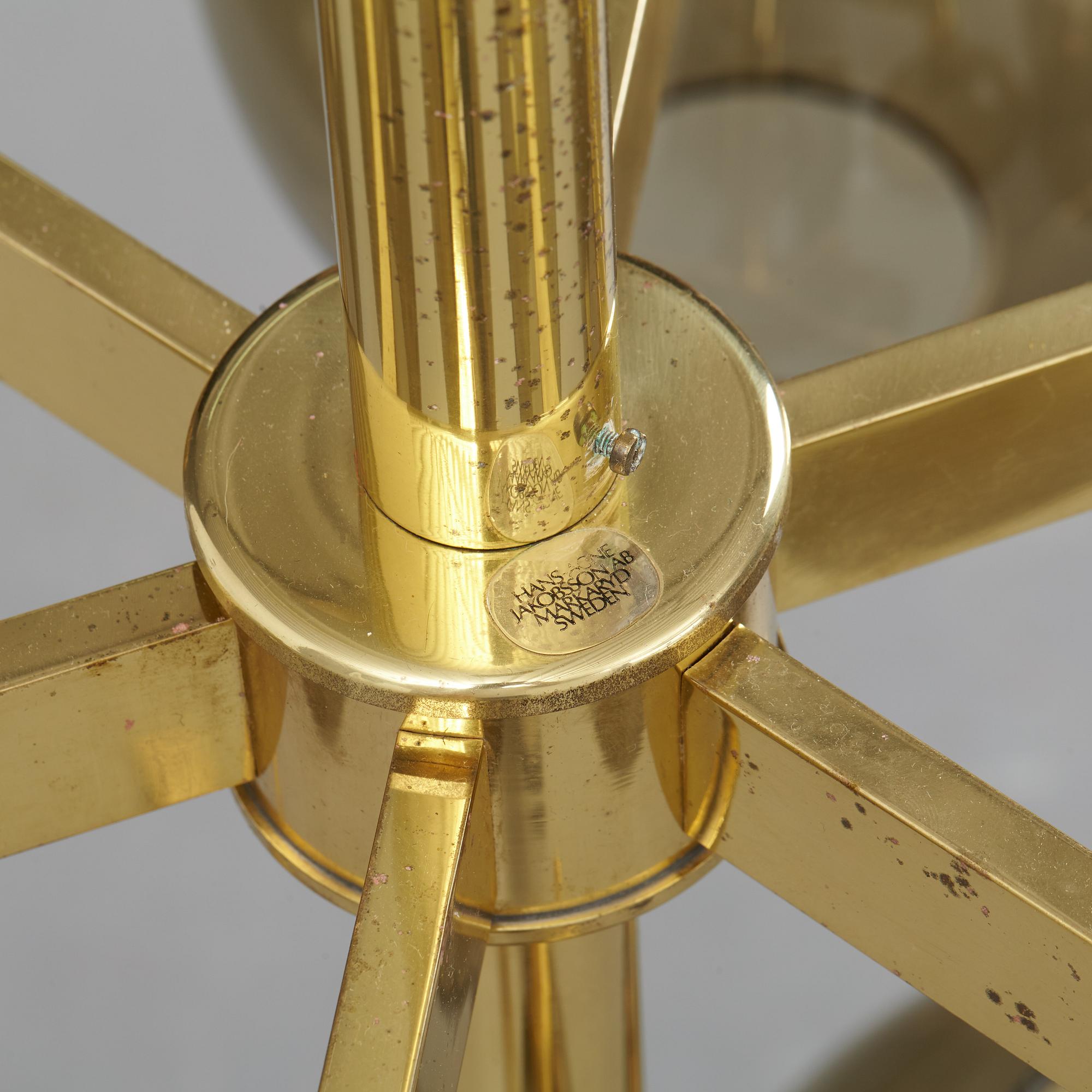 HANS-AGNE JAKOBSSON, a brass and glass nine-light ceiling light from Markaryd, second half of the 20th century.