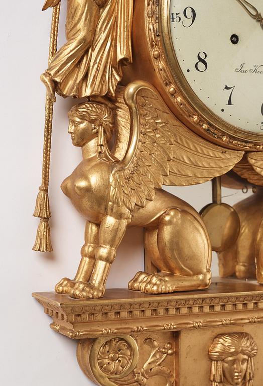 A late Gustavian giltwood cartel clock by J. Kock (royal watchmaker, active 1762-1803).