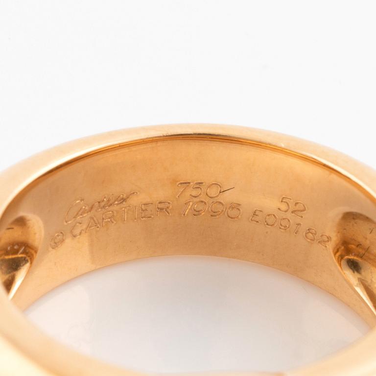 An 18K gold Cartier ring set with a tsavorite.