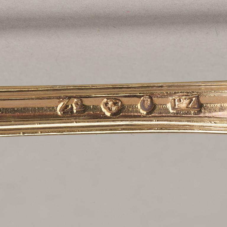 An early 19th century silver-gilt 24 piece table cutlery, mark of P Zethelius and G Folcker, Sthlm 1806 and 1826.