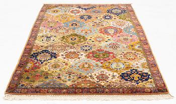 A semi-antique Safavid 'vase' design rug from Lahore, c. 243 x 141 cm.