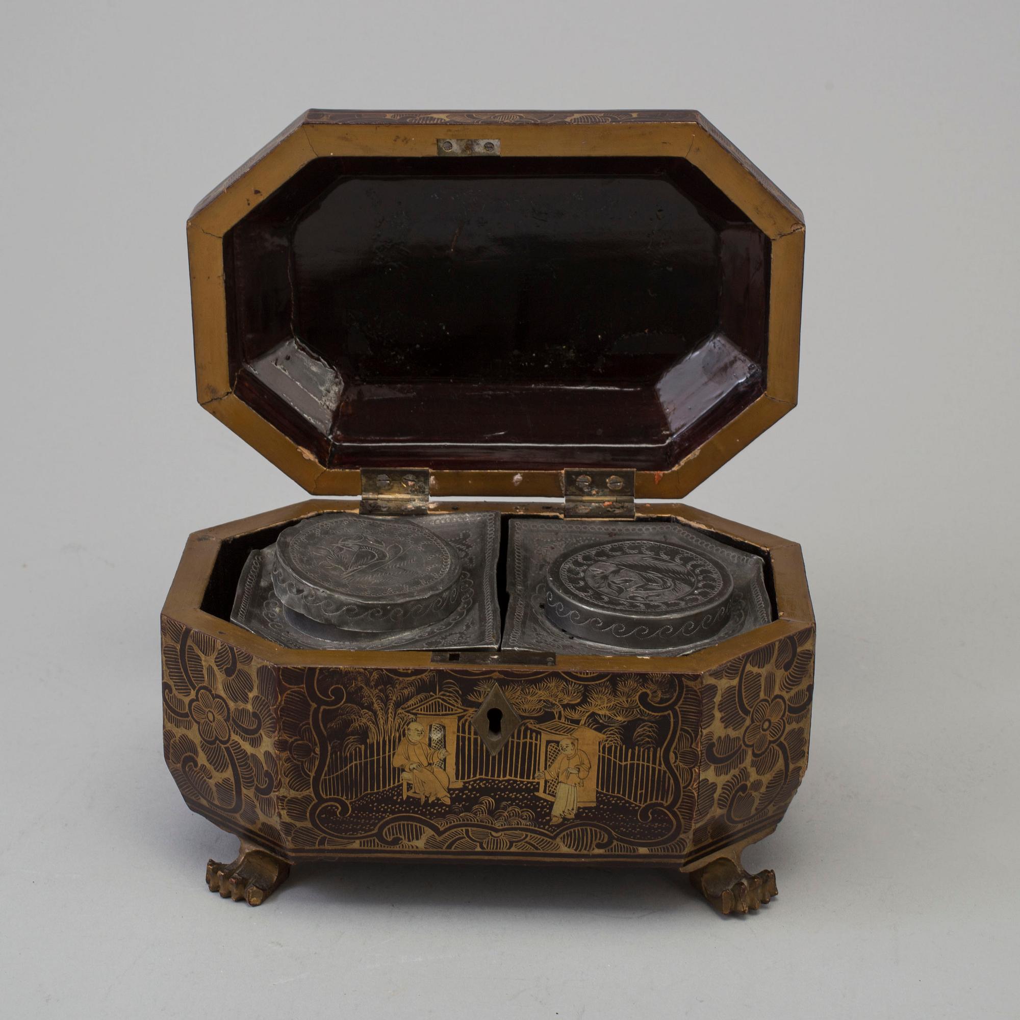 A Chinese Export Lacquerware Tea Caddy with Pewter Fitted Interior, 19th Century.