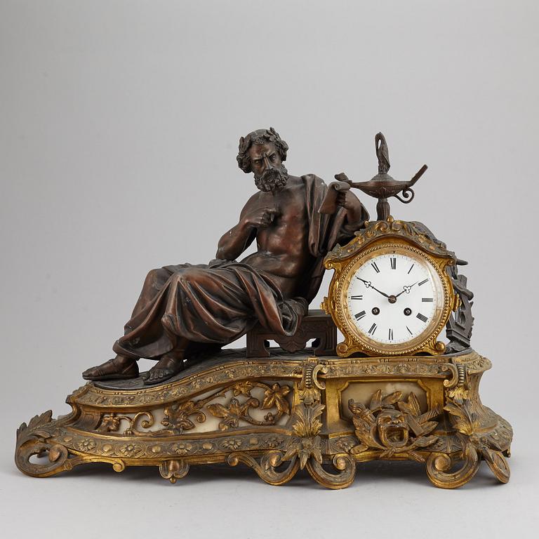 A large bronze mantle clock, circa 1900.