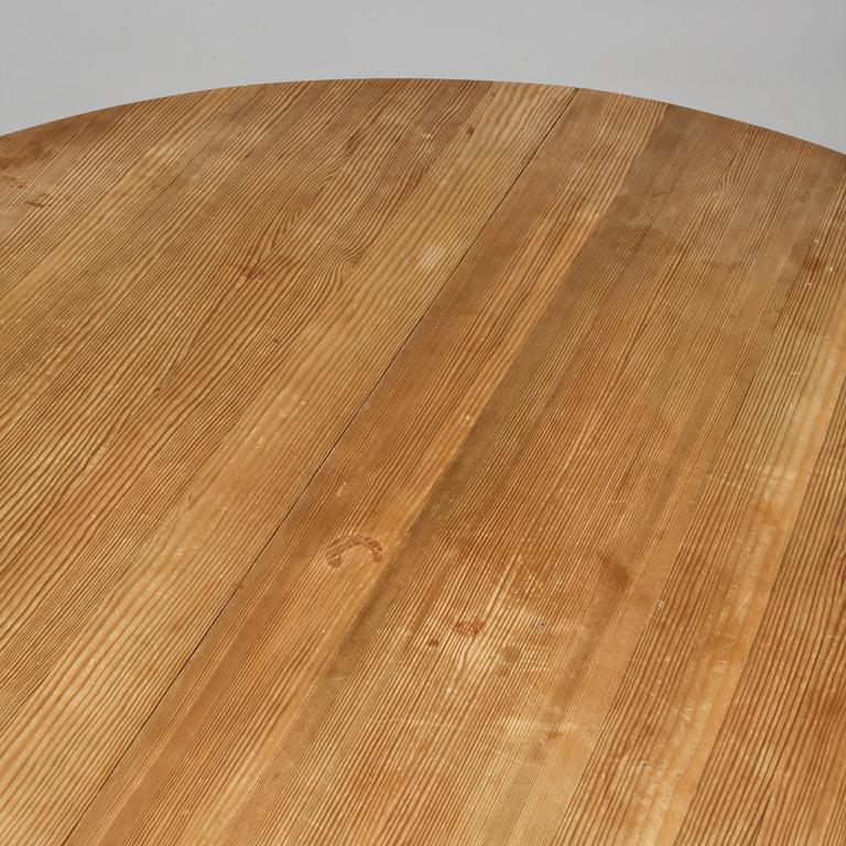 A stained pine dining table, attributed to Axel Einar Hjorth, Nordiska Kompaniet, 1930's.