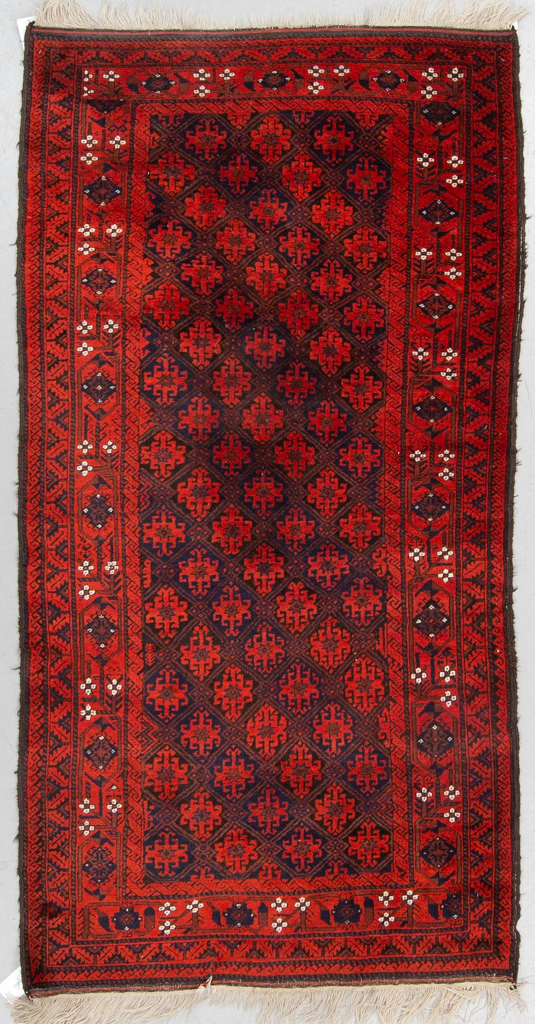 MATTO, a semi-antique Baluch, ca 210 x 110,5 cm (plus flat weave at the ends).