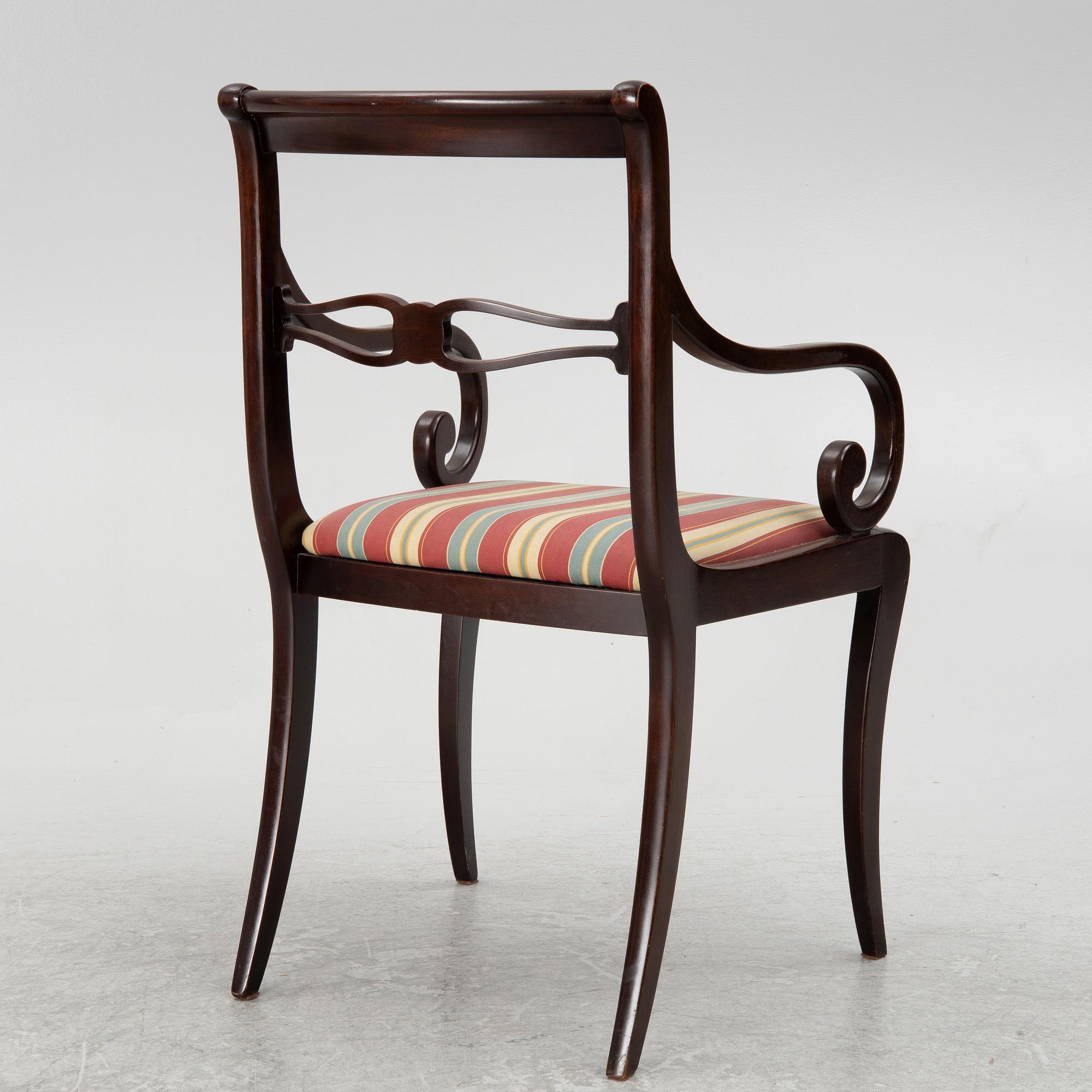 A mahogany veneer desk with desk chair, 20th Century.