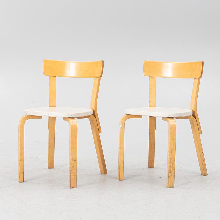 Alvar Aalto, a pair of model 69 chairs, Finland, second half of the 20th century.