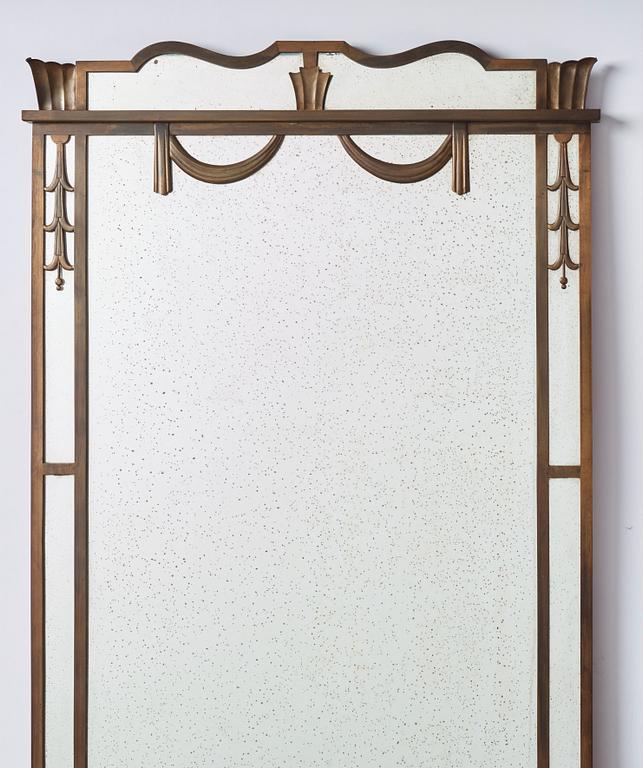 Swedish Grace, a brass framed wall mirror, 1920-30s.